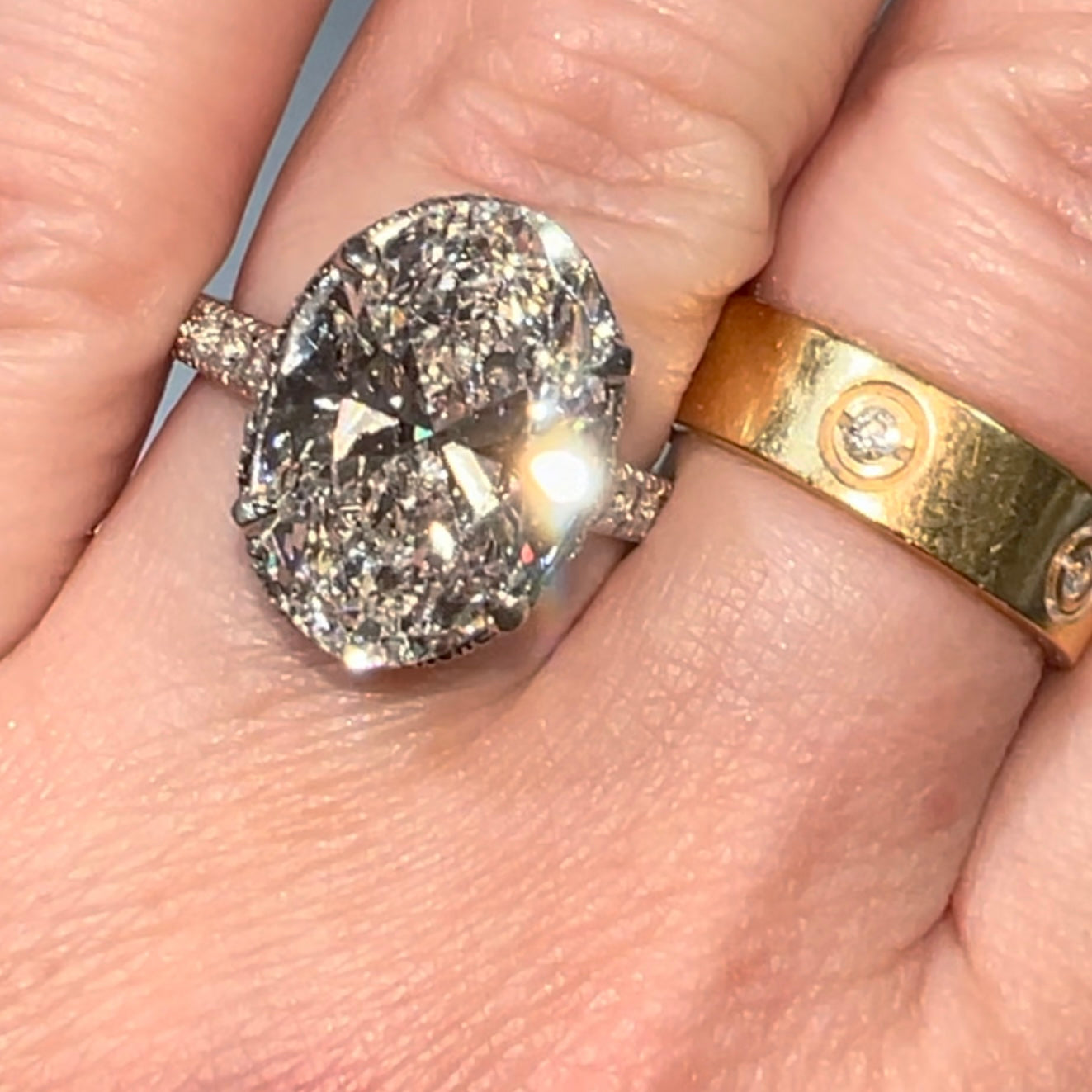New platinum 6.09TCW main lab created oval diamond plus ~1TCW natural diamonds on the sides ring