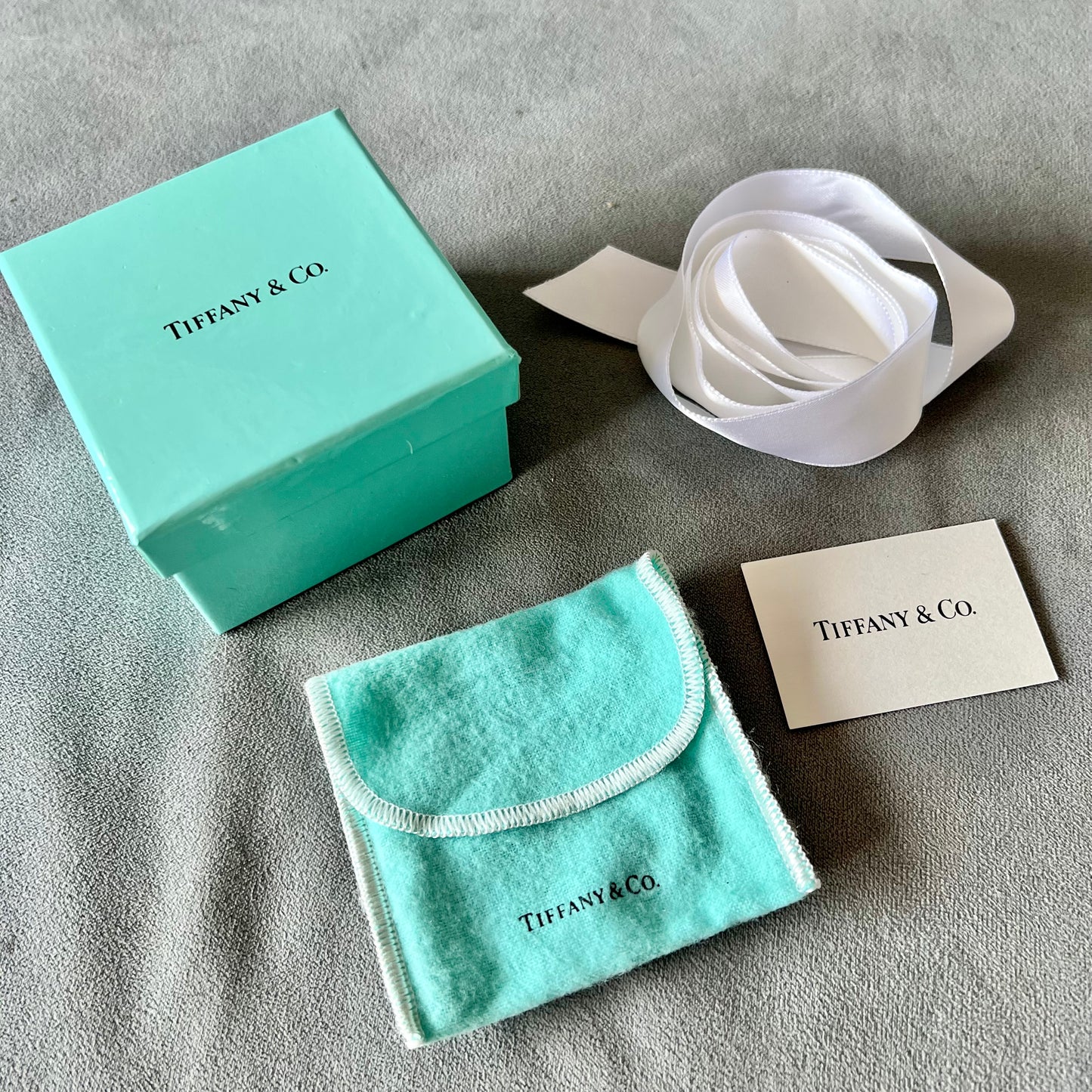 TIFFANY & CO. Jewelry Pouch + Booklet + Ribbon + Tissue + Box 3.20x3.20x2.10 inches