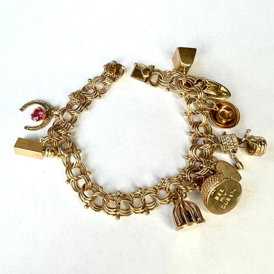 14K Yellow Gold 9 Charms Bracelet 7.5 inches long 43.19g