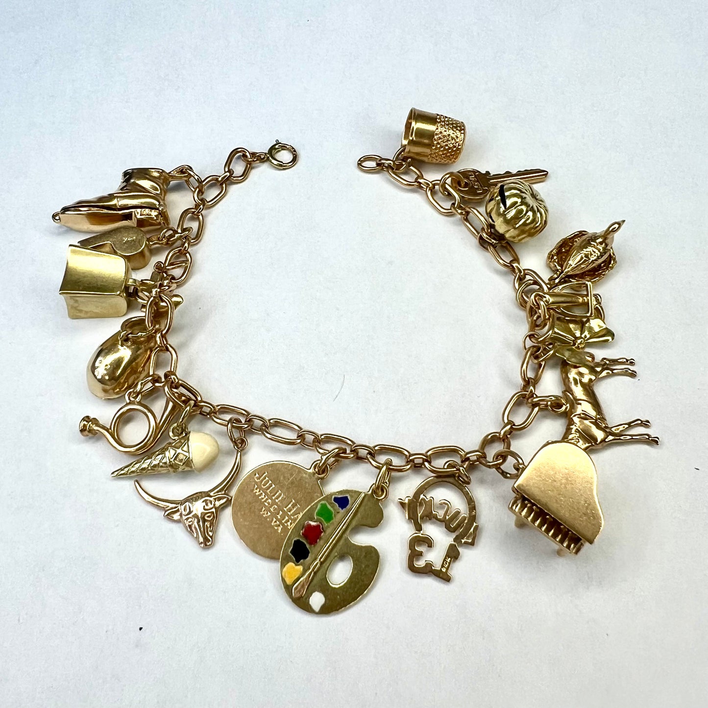 14K Yellow Gold 19 Charms Bracelet 7 inches long 27.11g